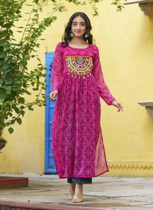 Garb These Beautiful Looking Readymade Navratri Kurti.These Kurti is Fabricated On Faux Georgette.Its Beautified With Bandhej Printed Designer With Kutchi Patch Work.