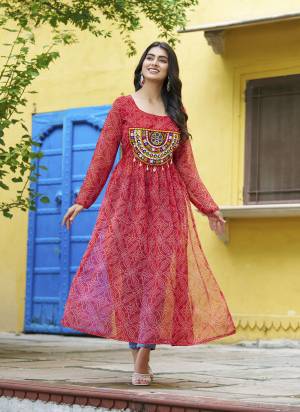 Garb These Beautiful Looking Readymade Navratri Kurti.These Kurti is Fabricated On Faux Georgette.Its Beautified With Bandhej Printed Designer With Kutchi Patch Work.