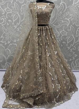 For A Fancy Designer Look,Grab These Lehenga Choli With Dupatta in Fine Colored.These Lehenga And Choli Are Net And Dupatta Are Fabricated On Net Pair.Its Beautified With Fancy Designer Dori,Rainbow Sequance Embroidery With Zarkan Work. 