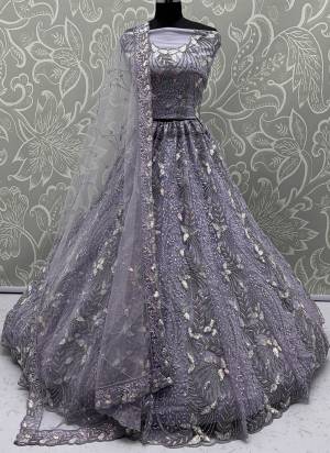 For A Fancy Designer Look,Grab These Lehenga Choli With Dupatta in Fine Colored.These Lehenga And Choli Are Net And Dupatta Are Fabricated On Net Pair.Its Beautified With Fancy Designer Dori,Rainbow Sequance Embroidery With Zarkan Work. 