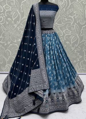 For A Fancy Designer Look,Grab These Lehenga Choli With Dupatta in Fine Colored.These Lehenga And Choli Are Georgette And Dupatta Are Fabricated On Georgette Pair.Its Beautified With Woven Jari Designer With Mirror Embroidery Work. 