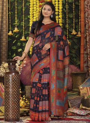 Garb These Fastive And Party Wear Saree in Fine Colored.These Saree And Blouse is Fabricated On Linen Cotton.Its Beautified With Heavy Woven Designer.