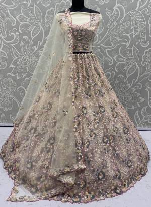For A Fancy Designer Look,Grab These Lehenga Choli With Dupatta in Fine Colored.These Lehenga And Choli Are Net And Dupatta Are Fabricated On Net Pair.Its Beautified With  5 Color Sequance,Flower Pattern,Multy Thread Embroidery Work. 