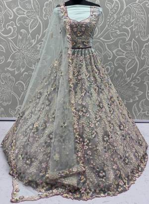 For A Fancy Designer Look,Grab These Lehenga Choli With Dupatta in Fine Colored.These Lehenga And Choli Are Net And Dupatta Are Fabricated On Net Pair.Its Beautified With  5 Color Sequance,Flower Pattern,Multy Thread Embroidery Work. 