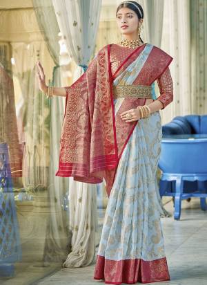Garb These Fastive And Party Wear Saree in Fine Colored.These Saree And Blouse is Fabricated On Linen Cotton.Its Beautified With Heavy Woven Designer.