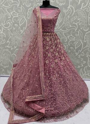 For A Fancy Designer Look,Grab These Lehenga Choli With Dupatta in Fine Colored.These Lehenga And Choli Are Net And Dupatta Are Fabricated On Net Pair.Its Beautified With  Multy Thread, Sequance,Jari Embroidery,Zarkan Work. 