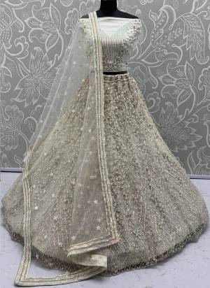For A Fancy Designer Look,Grab These Lehenga Choli With Dupatta in Fine Colored.These Lehenga And Choli Are Net And Dupatta Are Fabricated On Net Pair.Its Beautified With  Multy Thread, Sequance,Jari Embroidery,Zarkan Work. 