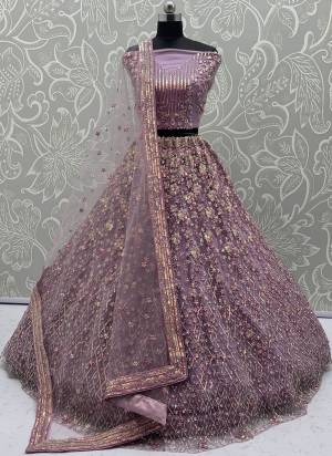 For A Fancy Designer Look,Grab These Lehenga Choli With Dupatta in Fine Colored.These Lehenga And Choli Are Net And Dupatta Are Fabricated On Net Pair.Its Beautified With  Multy Thread, Sequance,Jari Embroidery,Zarkan Work. 