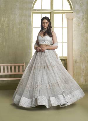 For A Different Look,Grab These Party Wear Designer Lehenga in All Over Pretty Colored Pair With Blouse And Dupatta.These Lehenga Choli And Dupatta is All Over Butterfly Net Base Fabric With Designer Tone To Tone Thread,Sequance Embroidery Work.