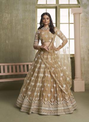 For A Different Look,Grab These Party Wear Designer Lehenga in All Over Pretty Colored Pair With Blouse And Dupatta.These Lehenga Choli And Dupatta is All Over Butterfly Net Base Fabric With Designer Cotton Thread,Sequance,Mirror Embroidery Work.