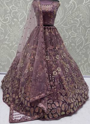 For A Fancy Designer Look,Grab These Lehenga Choli With Dupatta in Fine Colored.These Lehenga And Choli Are Net And Dupatta Are Fabricated On Net Pair.Its Beautified With Multy Thread,Sequance Embroidery,Zarcon Diamond Work. 