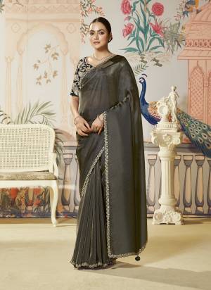 Look Attractive These Designer Party Wear Fancy Saree in Fine Colored.These Saree Are Jari Organza Silk And Blouse Two Tone Satin Silk is Fabricated.Its Beautified Fancy Dual Sequance Embroidery Work.