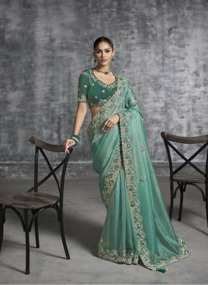 Looking These Fastival Wear Saree in Fine Colored.These Saree Are Tissue Silk And Blouse is Fabricated On Silk.Its Beautified With Designer Mirror,Jari,Sequance Embroidery With Pearl Stone Work.