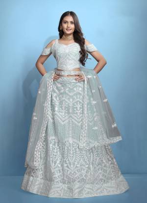 Grab These Beautiful Colored Lehenga Choli.These Lehenga and Dupatta Are Fabricated On Net Pair With Net Blouse.Its Beautified With Designer Thread Embroidery Work.
