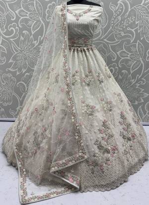 For A Fancy Designer Look,Grab These Lehenga Choli With Dupatta in Fine Colored.These Lehenga And Choli Are Net And Dupatta Are Fabricated On Soft Net Pair.Its Beautified With Heavy Flower Multy Cotton Thread,Silver Dori, Sequance Embroidery,Zarkon Diamond With Crystal Pipi Hand Work. 