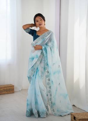 Garb These Party Wear Saree in Fine Colored.These Saree Are Fendy And Blouse is Malai Silk Fabricated.Its Beautified With Badal Printed Designer With Sequance,Coding Embroidery Work.