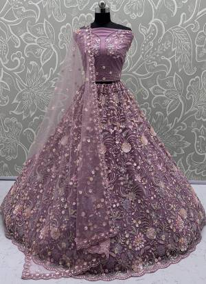 For A Fancy Designer Look,Grab These Lehenga Choli With Dupatta in Fine Colored.These Lehenga And Choli Are Net And Dupatta Are Fabricated On Soft Net Pair.Its Beautified With Heavy Multy Thread,Dori,Sequance Embroidery,Zarkon Diamond Work. 