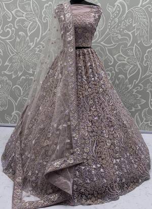For A Fancy Designer Look,Grab These Lehenga Choli With Dupatta in Fine Colored.These Lehenga And Choli Are Net And Dupatta Are Fabricated On Soft Net Pair.Its Beautified With Heavy Multy Thread,Dori,Sequance Embroidery,Zarkon Diamond Work. 