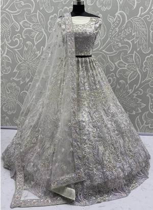 For A Fancy Designer Look,Grab These Lehenga Choli With Dupatta in Fine Colored.These Lehenga And Choli Are Net And Dupatta Are Fabricated On Soft Net Pair.Its Beautified With Heavy Multy Thread,Dori,Sequance Embroidery,Zarkon Diamond Work. 