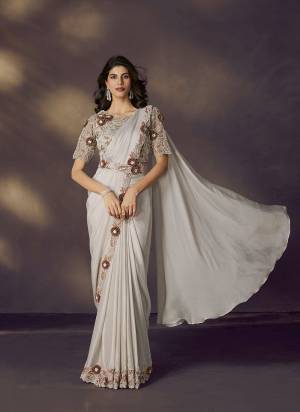 Look Attrective These Designer Party Wear Ready To Wear Saree With Blouse in Fine Colored.These Saree Are Two Tone Satin Silk And Blouse Tissue Silk is Fabricated.Its Beautified Solid,Heavy Fancy Desiger Embroidery With Hand Work .