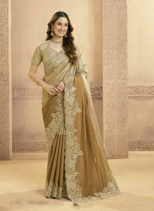 Look Attractive These Designer Party Wear Fancy Saree in Fine Colored.These Saree Are Matallic Kora Jari Silk And Blouse Matallic Kora Jari Silk is Fabricated.Its Beautified Fancy Sandwich Sequance,Beads Work,Scallops.