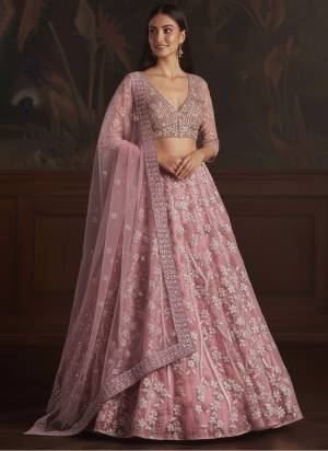 For A Fancy Designer Look,Grab These Lehenga Choli With Dupatta in Fine Colored.These Lehenga And Choli Are Net And Dupatta Are Fabricated On Soft Net Pair.Its Beautified With Fancy Dori, Sequance Embroidery,Zarcon Diamond Work. 