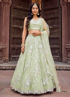 Attrective Looking This Party Wear Fine Color Fancy Heavy Designer Choli And Lahenga Fabriced On Net And Dupatta Net In Fabricated Beautified With Attrective Designer Heavy Sequance, Thread Embroidery Work. Buy Now.