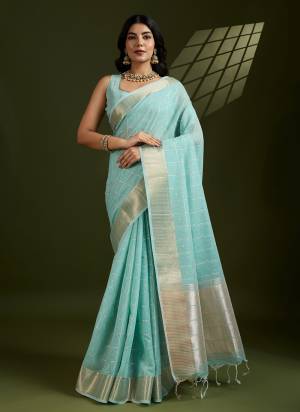 Looking These Festive Wear Saree in Fine Colored.These Saree And Blouse is Fabricated On Tissue Linen Silk.Its Beautified With Weaving Checks Designer.