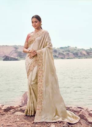 Attrective This Party wear Saree Paired With Blouse.This Saree Are Satin Silk And Blouse Are Tissue Silk Based Fabric With Designer Sequance,Jari,Thread Embroidery,Beads,Stone,Tassels Work. Buy This Pretty Saree Now.