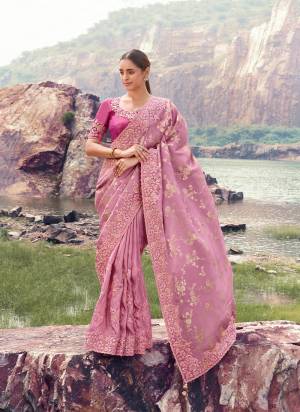 Attrective This Party wear Saree Paired With Blouse.This Saree Are Tissue Jacquard Silk And Blouse Are Tissue Silk Based Fabric With Weaving Jari Designer With Sequance,Jari,Thread Embroidery,Beads,Stone,Tassels Work. Buy This Pretty Saree Now.
