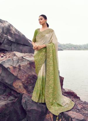 Attrective This Party wear Saree Paired With Blouse.This Saree Are Tissue Jacquard Silk And Blouse Are Tissue Silk Based Fabric With Weaving Jari Designer With Sequance,Jari,Thread Embroidery,Beads,Stone,Tassels Work. Buy This Pretty Saree Now.
