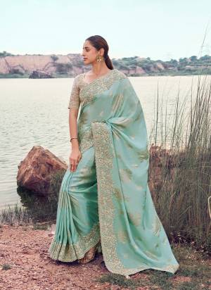 Attrective This Party wear Saree Paired With Blouse.This Saree Are Tissue Jacquard Silk And Blouse Are Tissue Silk Based Fabric With Weaving Jari Designer With Sequance,Jari,Thread Embroidery,Beads,Stone,Tassels Work. Buy This Pretty Saree Now.