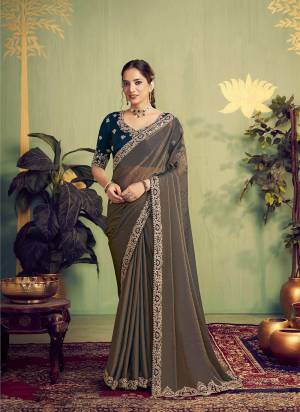 Look Attractive These Designer Party Wear Fancy Saree in Fine Colored.These Saree Are Jari Organza Satin And Blouse Two Tone Silk is Fabricated.Its Beautified Fancy Designer Embroidery, Hand Work.