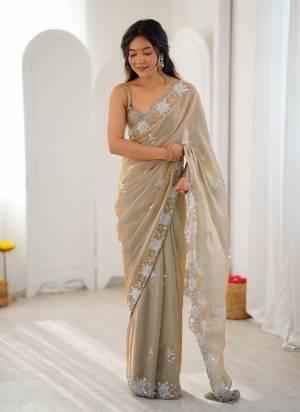 Looking These Fancy Party Wear Saree in Fine Colored.These Saree Are Fendy Satin And Blouse is Fendy Satin Fabricated.Its Beautified With Designer Sequance,Moti And Cut Dana Work.
