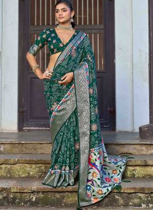 Looking These Traditinol Party Wear Saree in Fine Colored.These Saree Are Silk And Blouse is Fabricated On Silk Pair.Its Beautified With Woven Designer,Bandhani Ajrakh Printed.