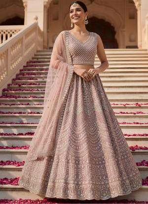 For A Fancy Designer Look,Grab These Lehenga Choli With Dupatta in Fine Colored.These Lehenga And Choli Are Net And Dupatta Are Fabricated On Soft Net Pair.Its Beautified With Heavy Designer Sequance,Dori Embroidery,Modif Crystal Pipe,Beads Hand Work. 