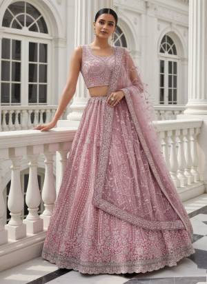 For A Fancy Designer Look,Grab These Lehenga Choli With Dupatta in Fine Colored.These Lehenga And Choli Are Net And Dupatta Are Fabricated On Soft Net Pair.Its Beautified With Heavy Multy Thread,Sequance,Dori Embroidery,Zircon Diamond Work. 