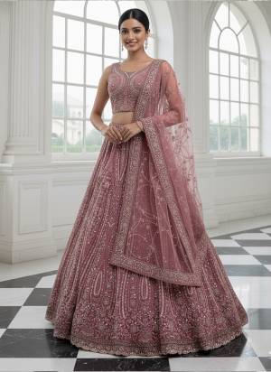 For A Fancy Designer Look,Grab These Lehenga Choli With Dupatta in Fine Colored.These Lehenga And Choli Are Net And Dupatta Are Fabricated On Soft Net Pair.Its Beautified With Heavy Multy Thread,Sequance,Dori Embroidery,Zircon Diamond Work. 