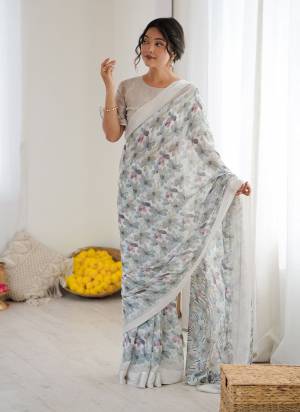 Garb These Party Wear Saree in Fine Colored.These Saree Are Moss Satin Patta And Blouse is Moss Satin Patta Fabricated.Its Beautified With Designer Printed.