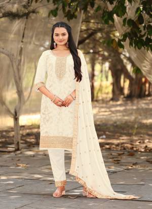 Attrective Looking These Party Wear Suit in Fine Colored Pair With Bottom And Dupatta.These Top Are Viscose Jacquard And Dupatta Are Fabricated On Chinon Pair With Santoon Bottom.Its Beautified With Woven Designer With Embroidery Work.