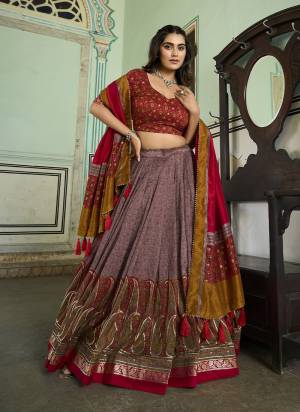 Looking These Party Wear Lehenga Choli in Fine Colored. These Lehenga And Blouse Are Tussar Silk And Dupatta Are Fabricated On Tussar Silk Fabriced. It is Beautified With Designer Kashmiri Foil  Printed.