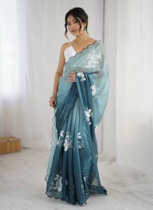 Garb These Party Wear Saree in Fine Dual Shaded Colored.These Saree Are Jimmy Choo And Blouse is Satin Silk Fabricated.Its Beautified With Pedding Color Printed With Designer Sequance Embroidery Work.