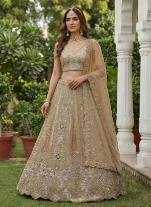 For A Fancy Designer Look,Grab These Lehenga Choli With Dupatta in Fine Colored.These Lehenga And Choli Are Bridal Net And Dupatta Are Fabricated On Soft Net Pair.Its Beautified With Fancy Dori, Sequance,Multy Thread,Jari Embroidery,Zarcon Diamond Work. 