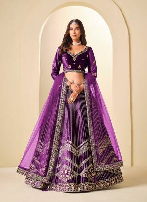 For A Designer Look,Grab These Party Wear Lehenga Choli in Fine Colored.These Lehenga And Blouse Are Fabricated On Ice Velvet Pair With Net Dupatta.Its Beautified With Designer Embroidery Work.