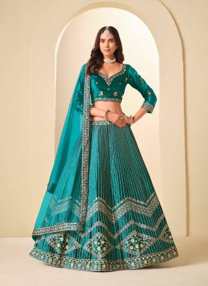For A Designer Look,Grab These Party Wear Lehenga Choli in Fine Colored.These Lehenga And Blouse Are Fabricated On Ice Velvet Pair With Net Dupatta.Its Beautified With Designer Embroidery Work.