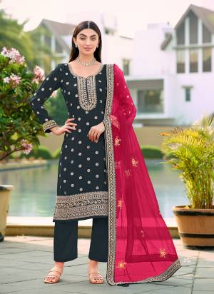 Attrective Looking These Party Wear Suit in Fine Colored Pair With Bottom And Dupatta.These Top Are Viscose Jacquard And Dupatta Are Fabricated On Net Pair With Santoon Bottom.Its Beautified With Woven Designer With Embroidery Work.