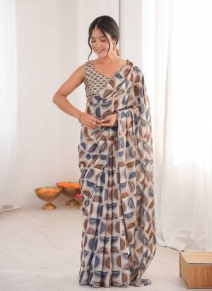 Garb These Party Wear Saree in Fine Colored.These Saree Are Chinon And Blouse is Chinon Fabricated.Its Beautified With Designer Digital Printed With Mirror Cut Work Border.