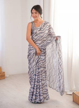 Garb These Party Wear Saree in Fine Colored.These Saree Are Chinon And Blouse is Chinon Fabricated.Its Beautified With Designer Digital Printed With Mirror Cut Work Border.