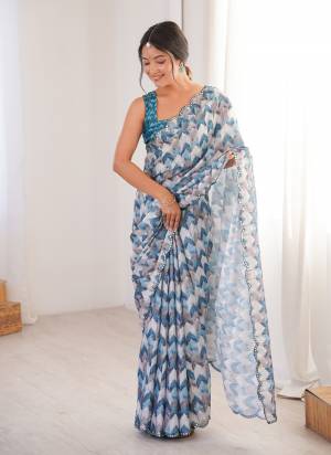 Garb These Party Wear Saree in Fine Colored.These Saree Are Chinon And Blouse is Chinon Fabricated.Its Beautified With Designer Digital Printed With Mirror Cut Work Border.