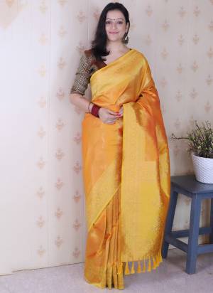 Looking These Party Wear Saree in Fine Colored.These Saree And Blouse is Fabricated On Soft Silk.Its Beautified With Weaving Laheriya Gold Jari Designer.